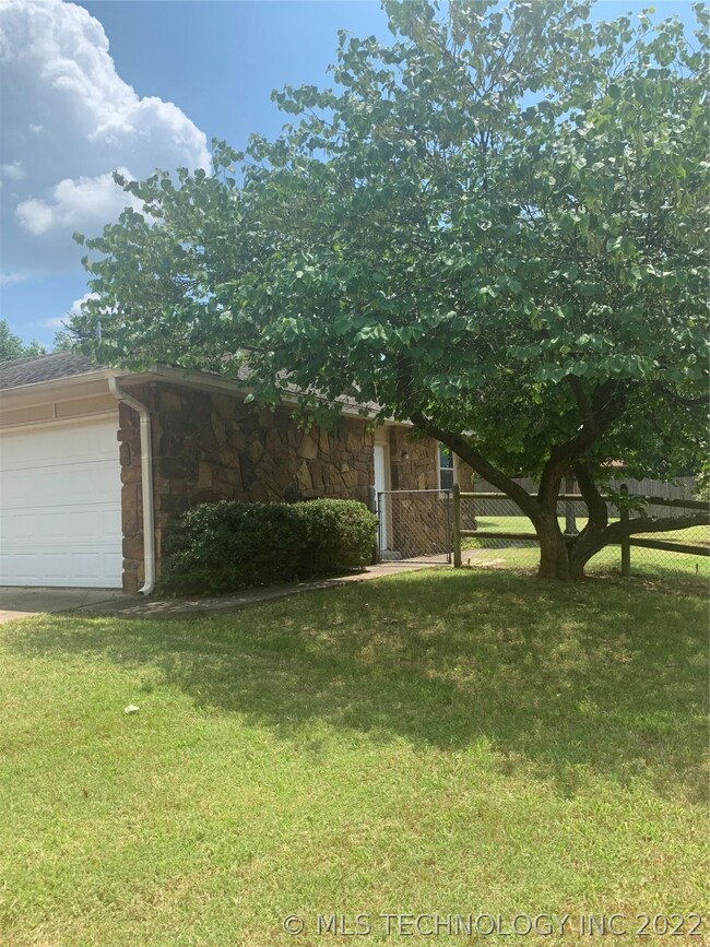 Large corner lot with landscaping.