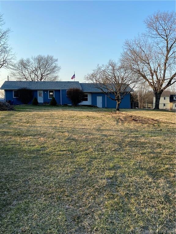 Back of home with flagstone patio.