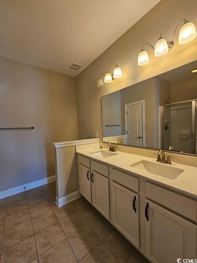 Bathroom with tile patterned flooring, vanity, and