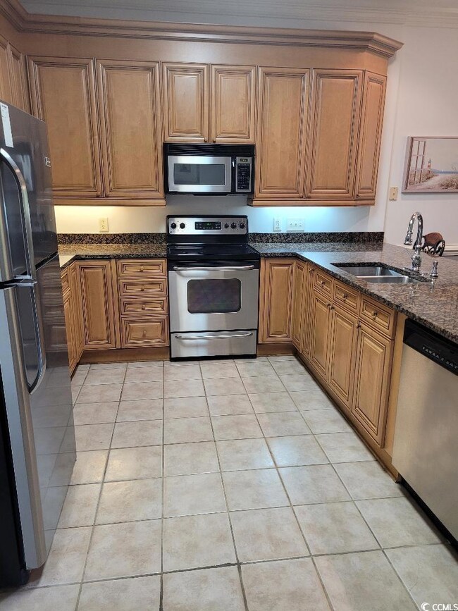 Kitchen featuring appliances with stainless steel 
