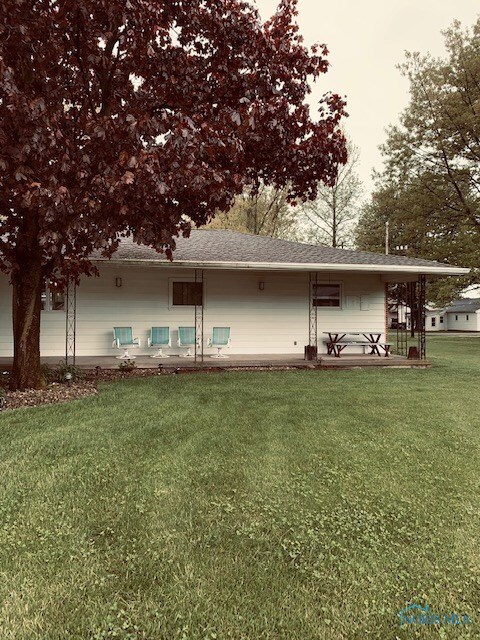The back patio overlooks the huge lot and make a g