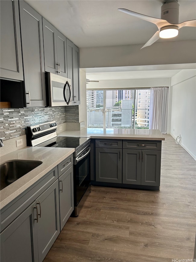 Kitchen looks into living room