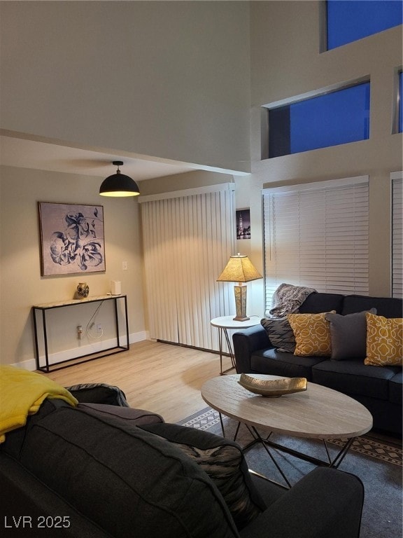 Living area with light wood-style flooring and a h