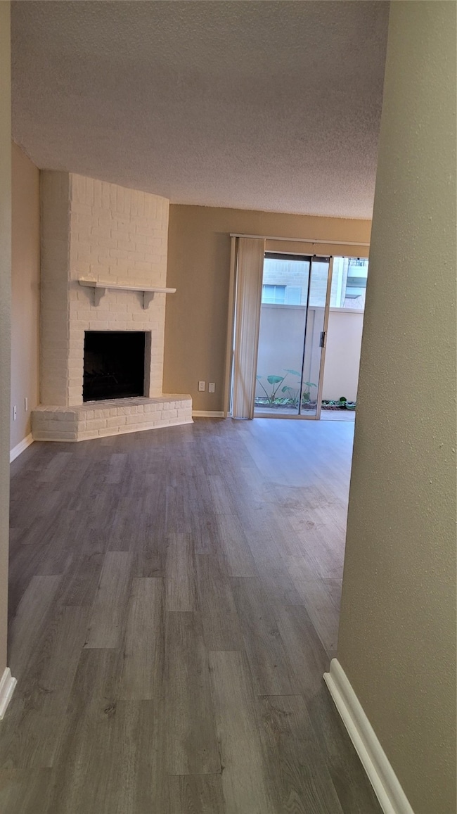 Fireplace in the living room next to a sliding win