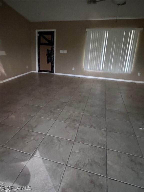 Empty room with tile flooring