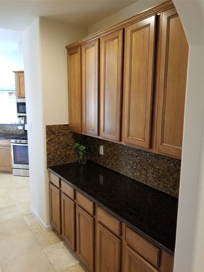 A Butler's Pantry leading into the Kitchen from the Formal Dining Room.
