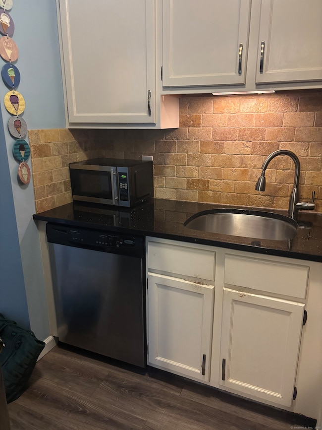 Granite Counters with stainless steel appliances.