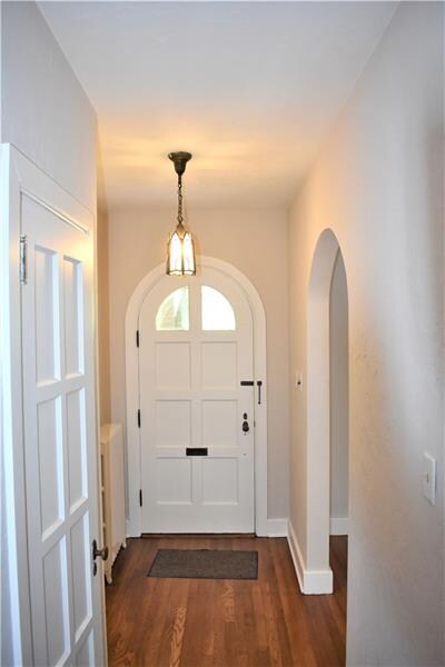 Entry with Arched Wood Door, 8 Panel Door on Guest