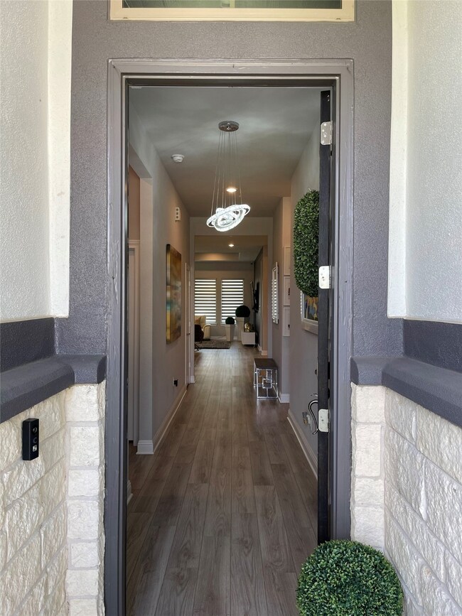 Enter the home to find luxury laminate plank flooring throughout, matching tiles in bathrooms.