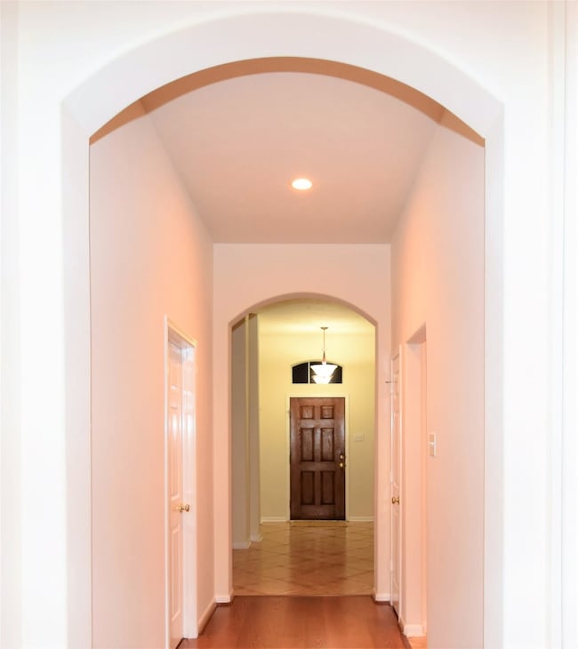 Inviting Extended Entry w/ Arched Doorways