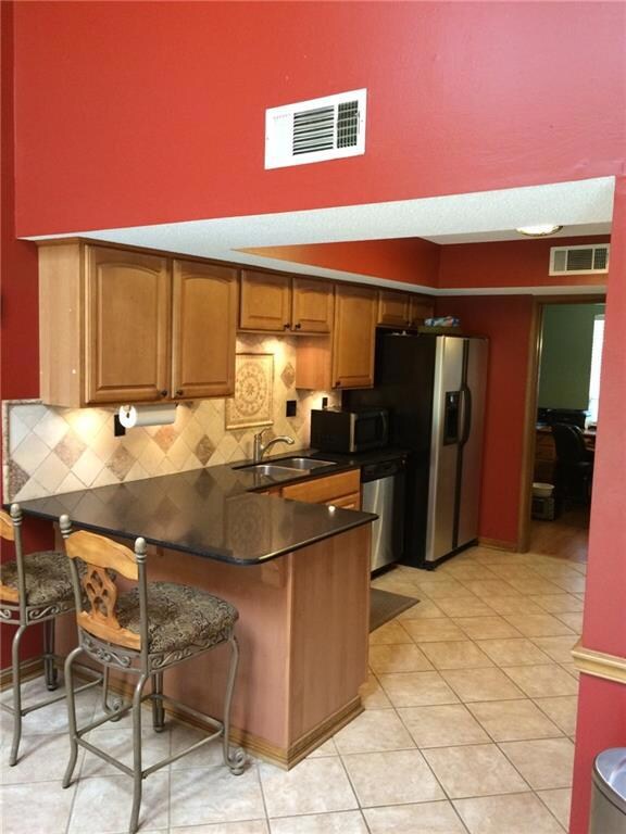 Additional view of kitchen with breakfast bar, gra
