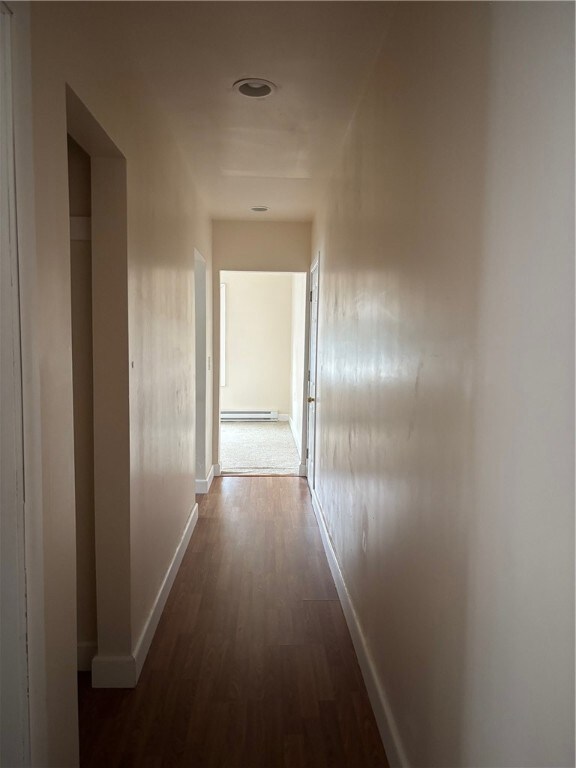Hallway leads to bedrooms, kitchen & living room is straight ahead