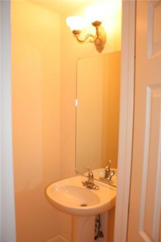 Half bath on main floor. Pretty pedestal sink!