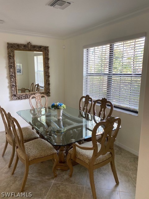 Dining space with tile flooring, a healthy amount