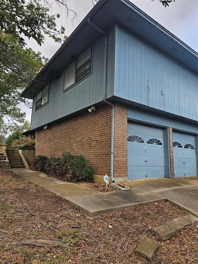 View of home's exterior with a garage