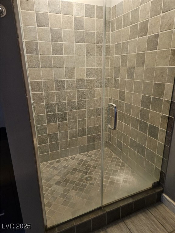 Bathroom featuring a shower stall