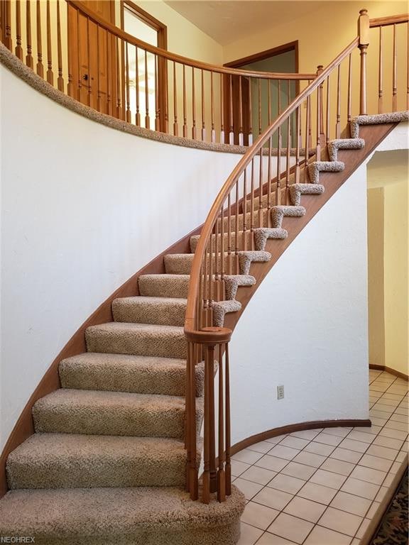 Graceful open staircase to second floor