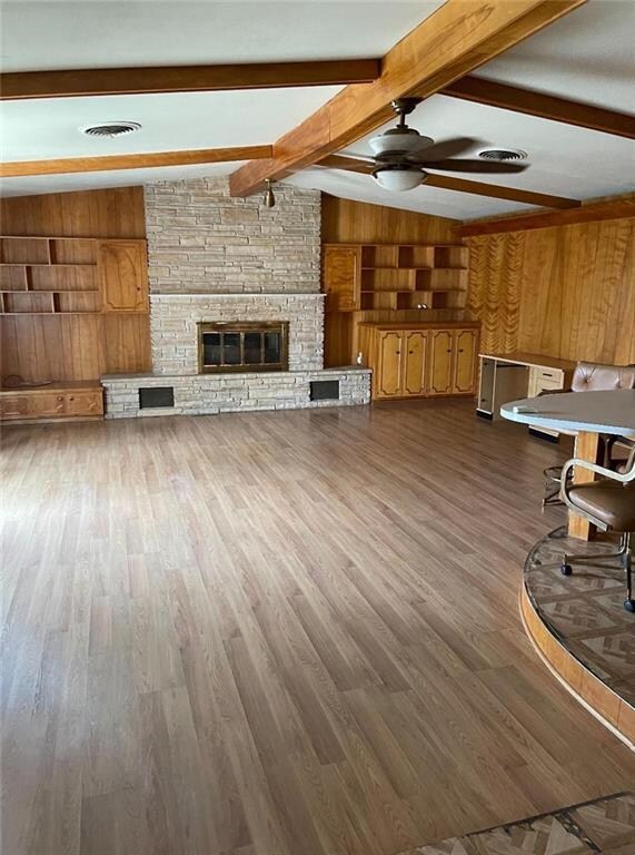 Very spacious family room with built in cabinets and book shelves. Area is open to the kitchen and built in dining bar.