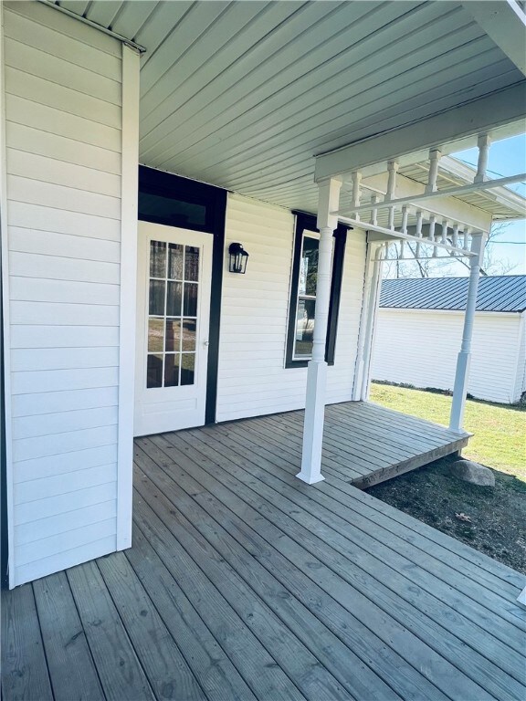Right side of the front porch.