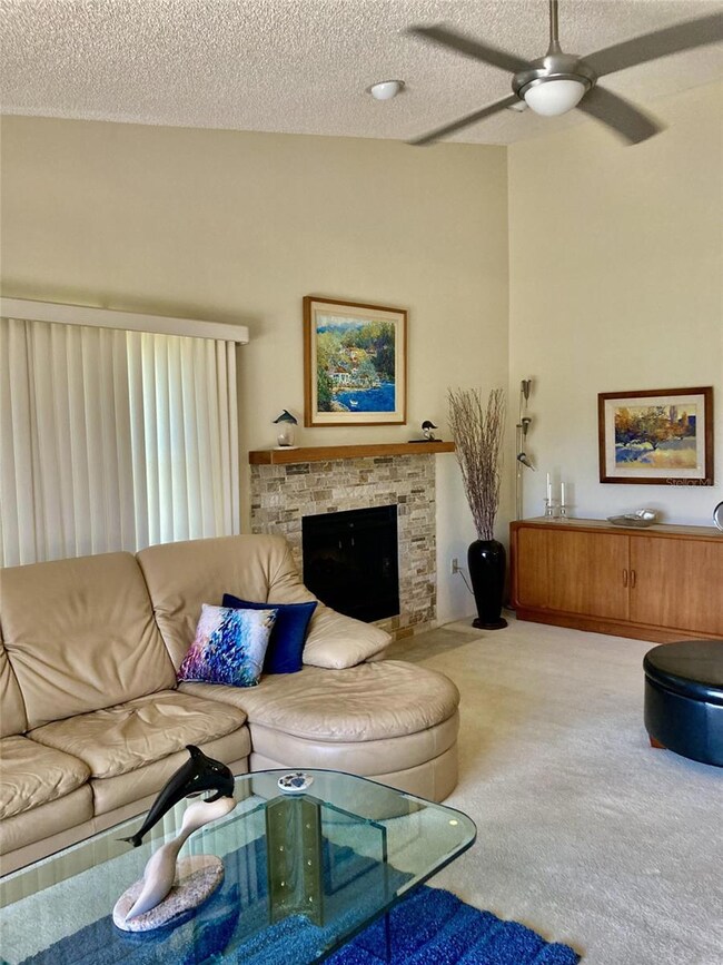 Living room features a fireplace.