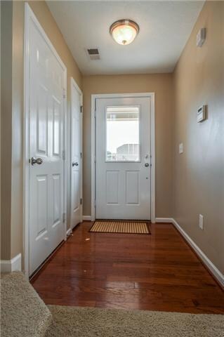 Gleaming hardwoods in the entry foyer welcome guests to your new home.