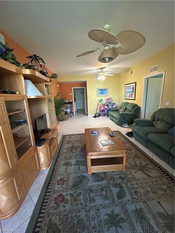Living room featuring tile patterned floors, visib