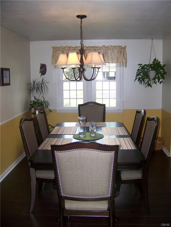 Tastefully decorated dining room with new floors &