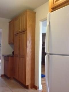 New cabinetry to the ceiling to maximize storage