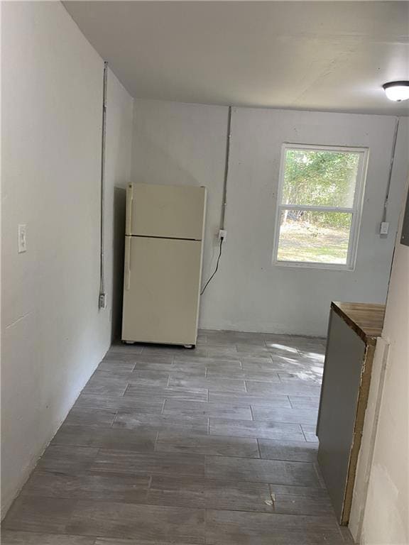 Unfurnished dining area with wood finished floors