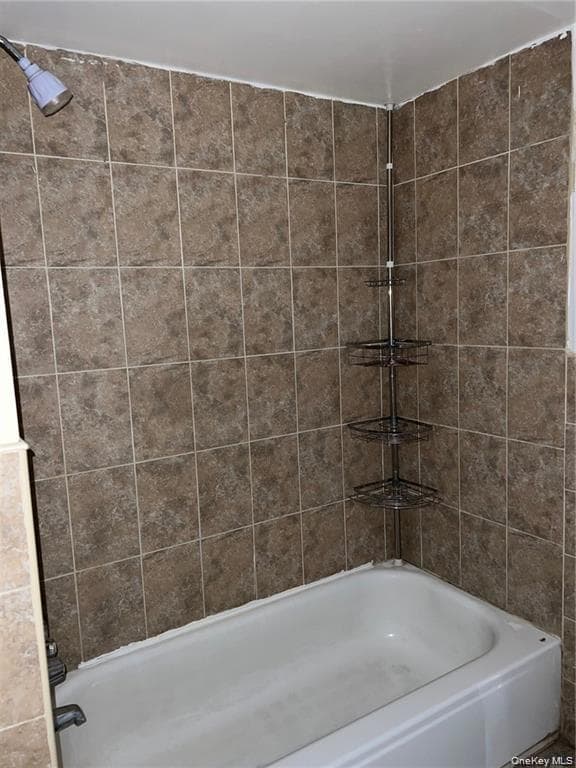 Bathroom featuring shower / bath combination