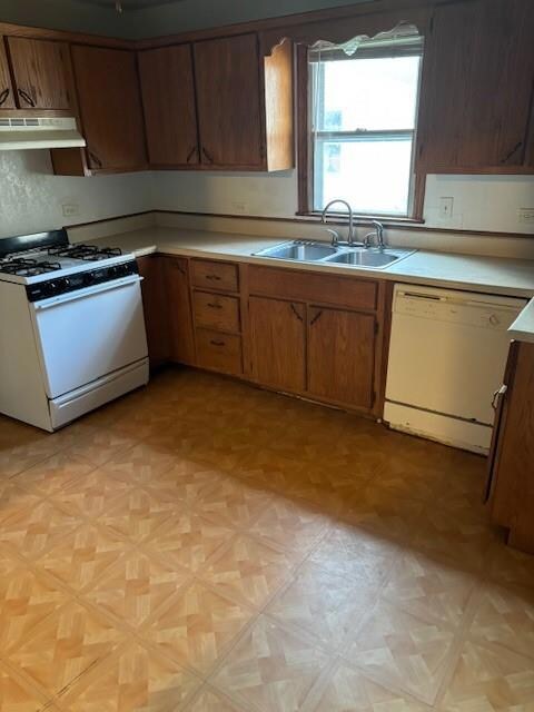 Kitchen featuring sink, light parquet flooring, an