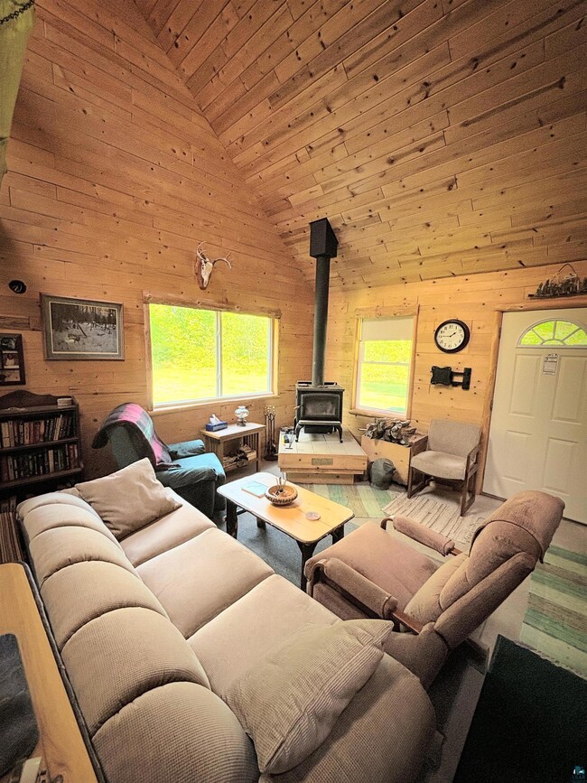 Living room with a wood stove, a healthy amount of