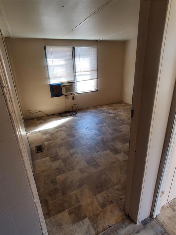 Spare room featuring tile flooring