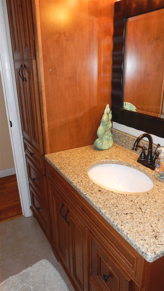 Linen Tower and Granite Sink Top with Oiled Bronze