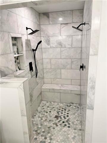Spacious walk-in master shower with dual showerhea