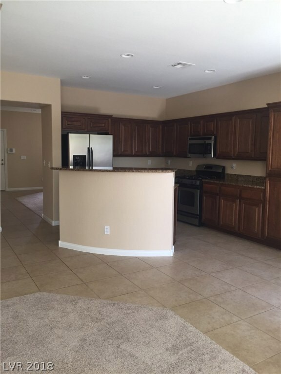 Kitchen Island, custom cabinets, stainless applian