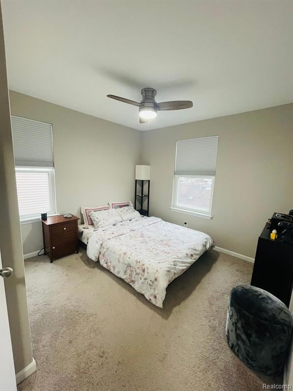 Bedroom with carpet and a ceiling fan