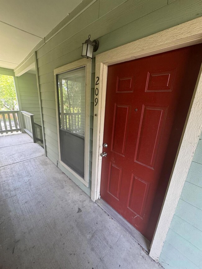 Entrance to property featuring a porch