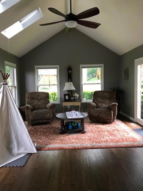 Off the Living Room is this delightful Sunroom/Den - with vaulted ceiling and access to patio and deck.