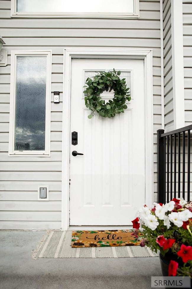 Large entry concrete porch. With metal railings.