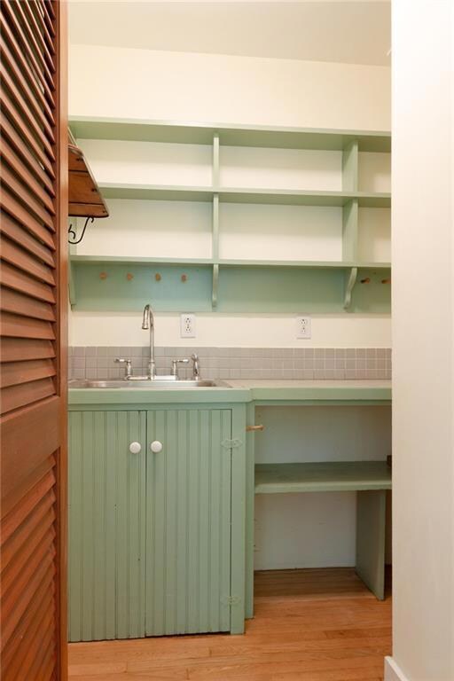Pantry off of the kitchen with sink...