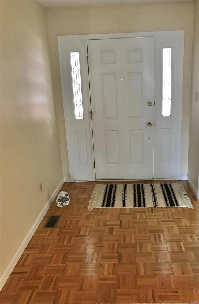 Foyer, Front door with side lites.  Parquet Floor.