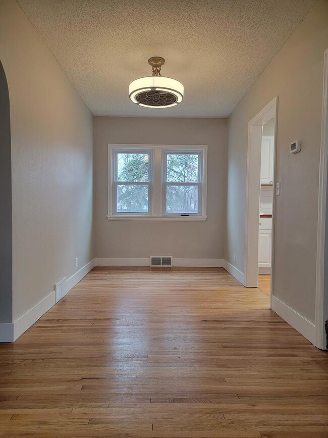 Cozy dining room off the kitchen opens to the living room.
