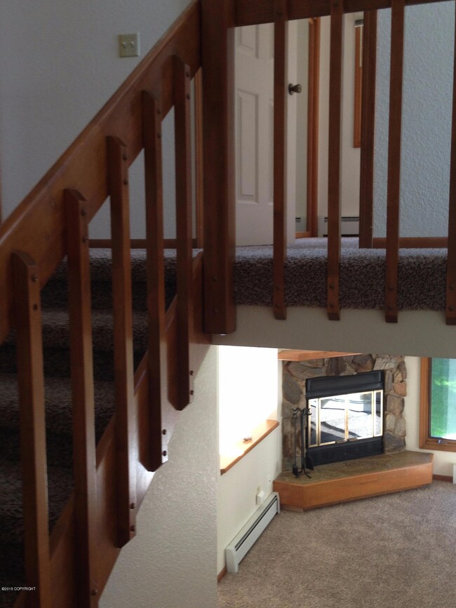 Stairwell Looking down to Fireplace in L