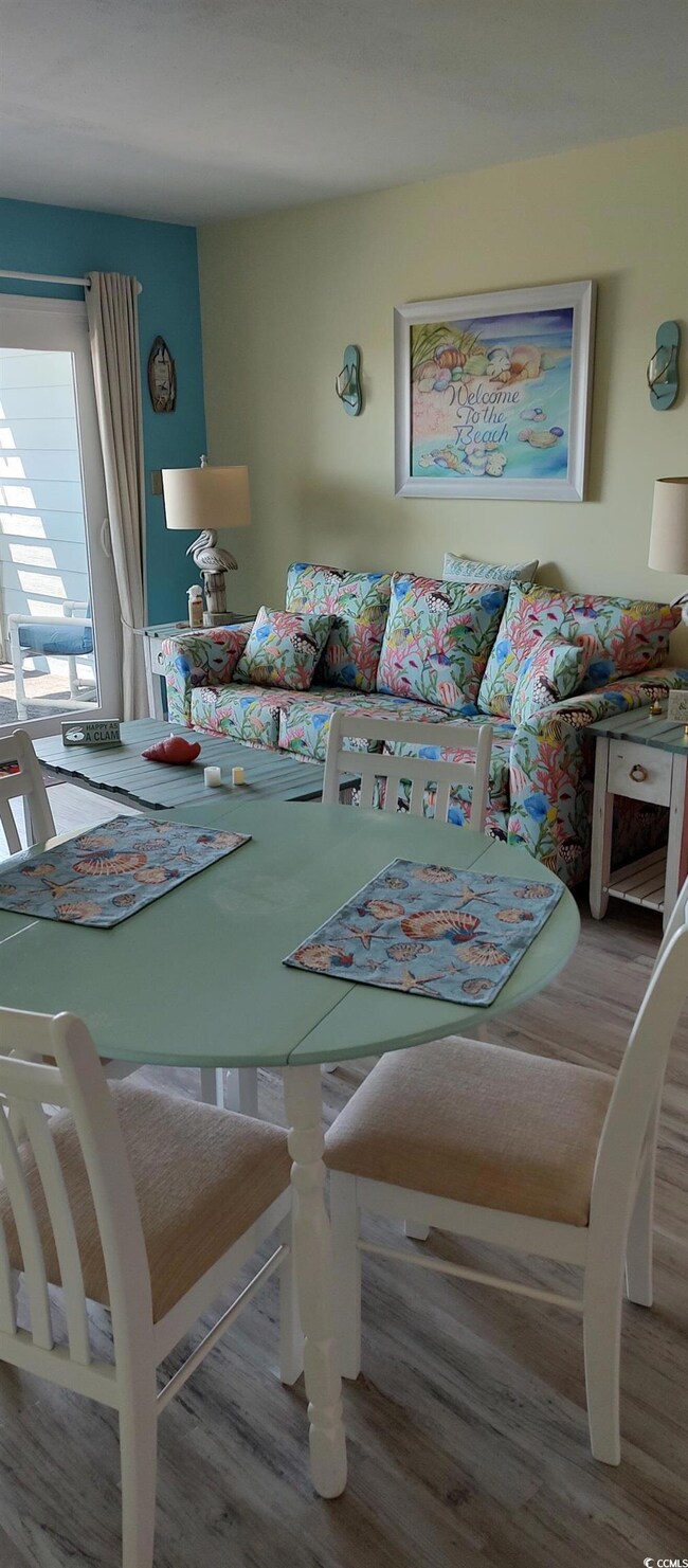Dining space featuring wood finished floors