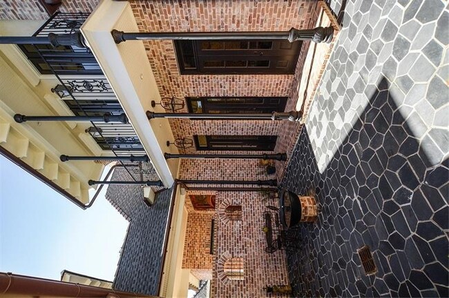 French Quarter-Style Slate Courtyard with French D
