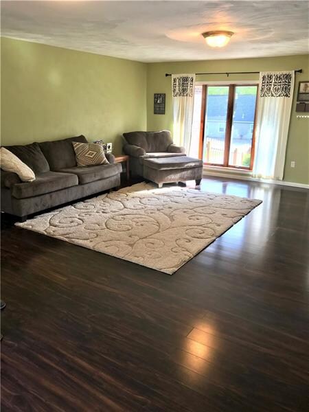 Large living room with an abundant of natural ligh