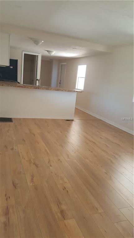 Living room looking into kitchen
