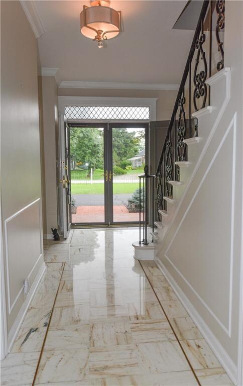 BEAUTIFUL ENTRY WITH HALL CLOSET LEADS TO FORMAL LIVING ROOM AND DINING ROOM.