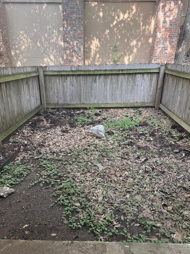 View of fenced backyard